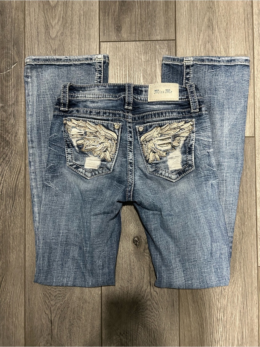 Miss Me Embellished Wing Back Pocket low-rise boot cut jeans
